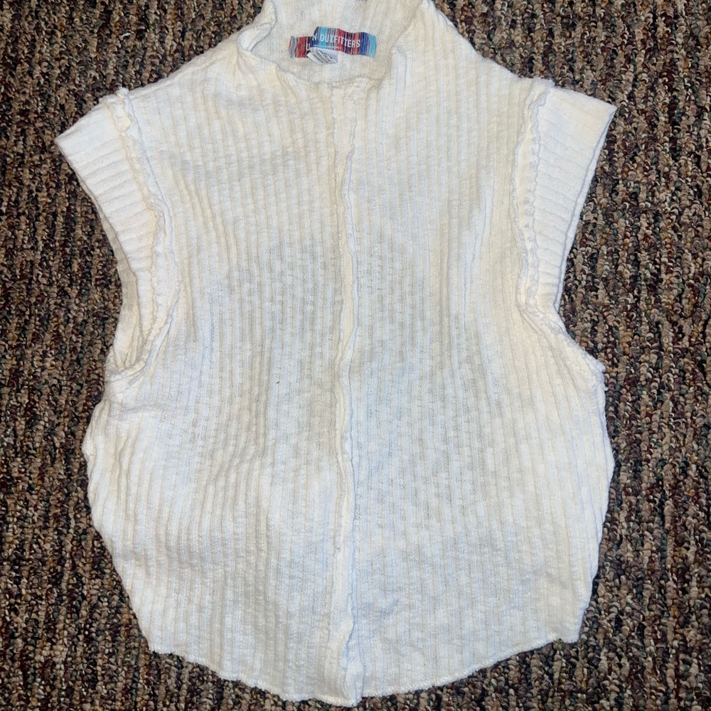 Urban Outfitters cream high-neck, open-back tank top.